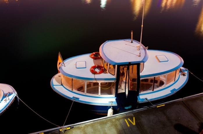 Small boat at night marina