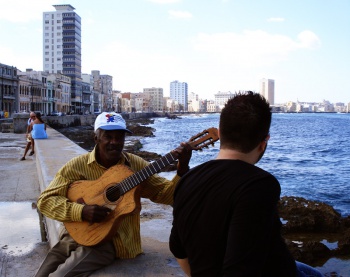 Cuban street musician asks Mark for song requests